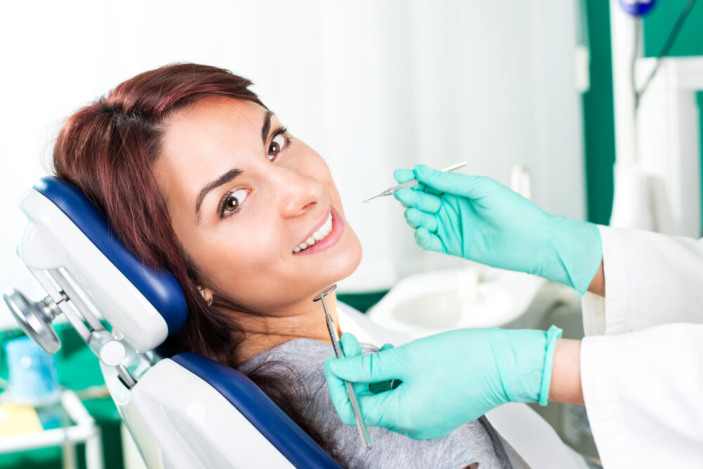 Bigstock Smiling Woman At Dentist 60729326 E1747323314596